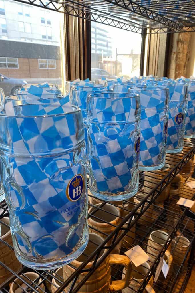 Beer glasses stuffed with blue and white checkered paper for sale.