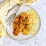 pan-seared catfish on a serving plate.