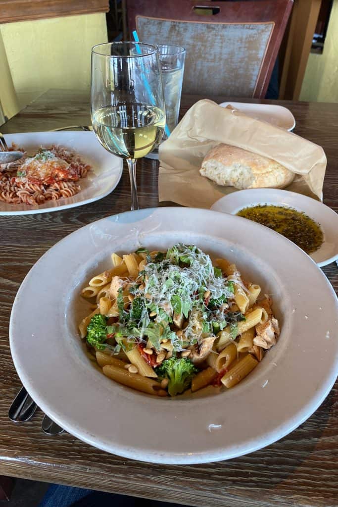 Penne Fresco with grilled chicken, pine nuts, pasta, and broccoli.
