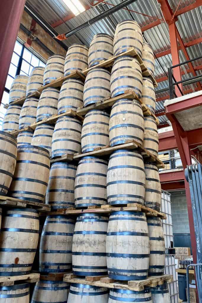 Stacks of barrels in warehouse at James E Pepper Distillery.