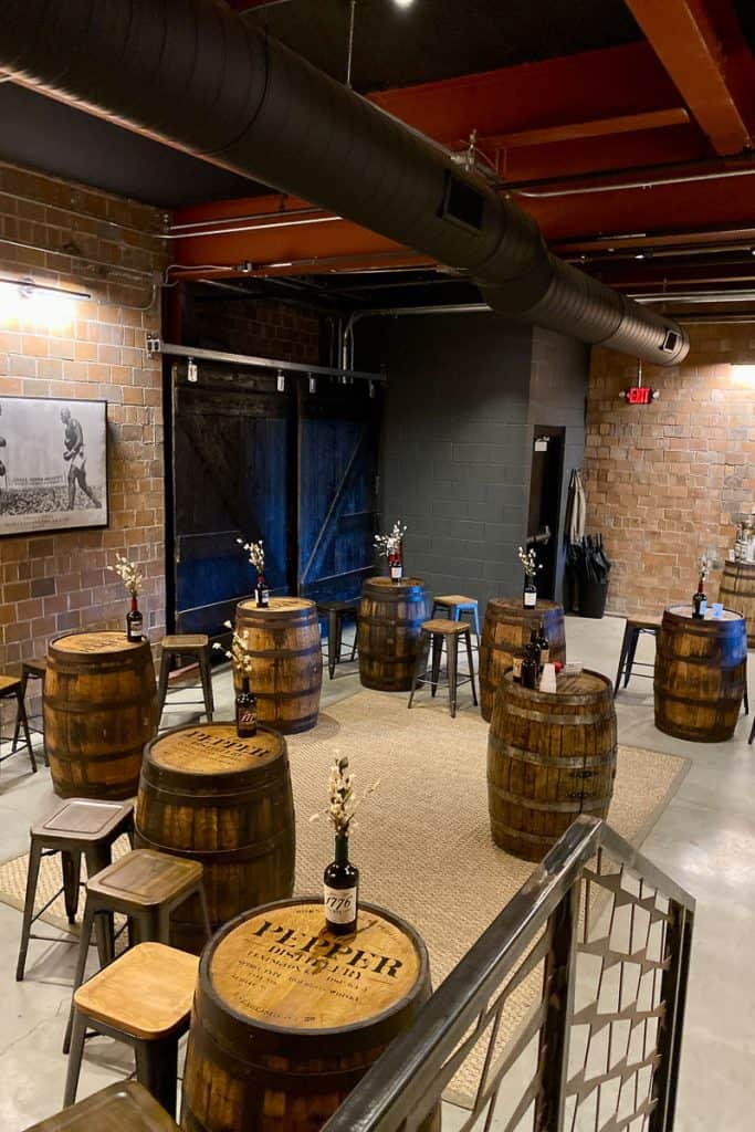 Tasting room with stools and barrels set up as tables.