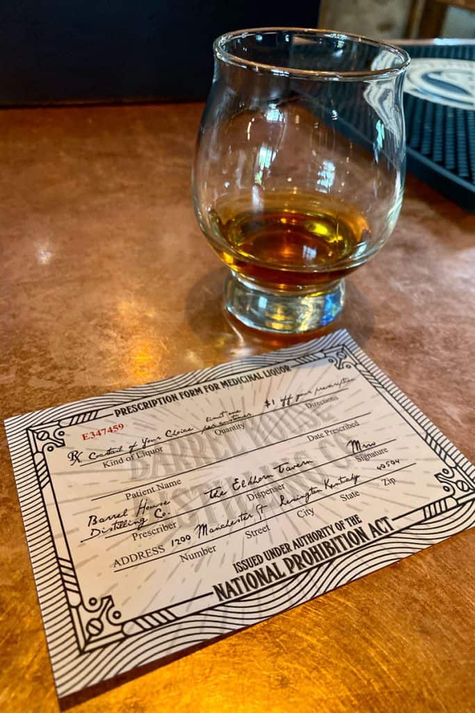 Bourbon sample next to souvenir prescription form for medicinal liquor.