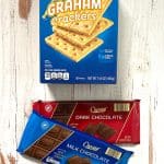 Packages of graham crackers and dark and milk chocolate.