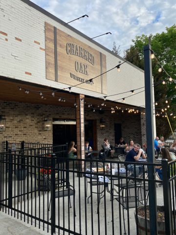 Outdoor dining at Charred Oak Whiskey Grill.