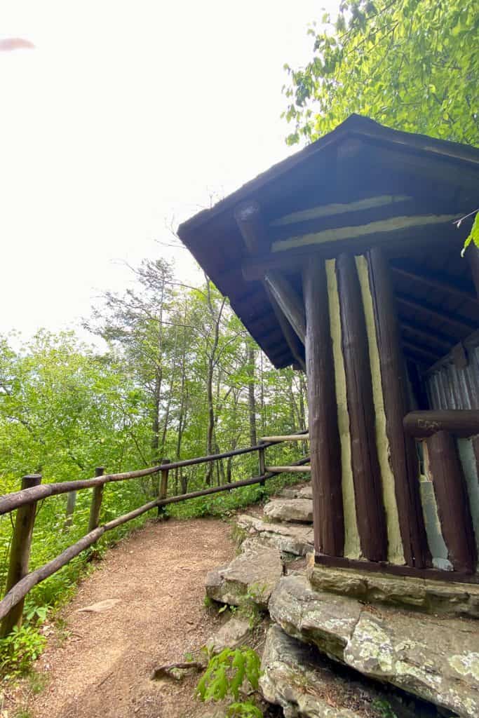 Wooden shelter along side of trail.