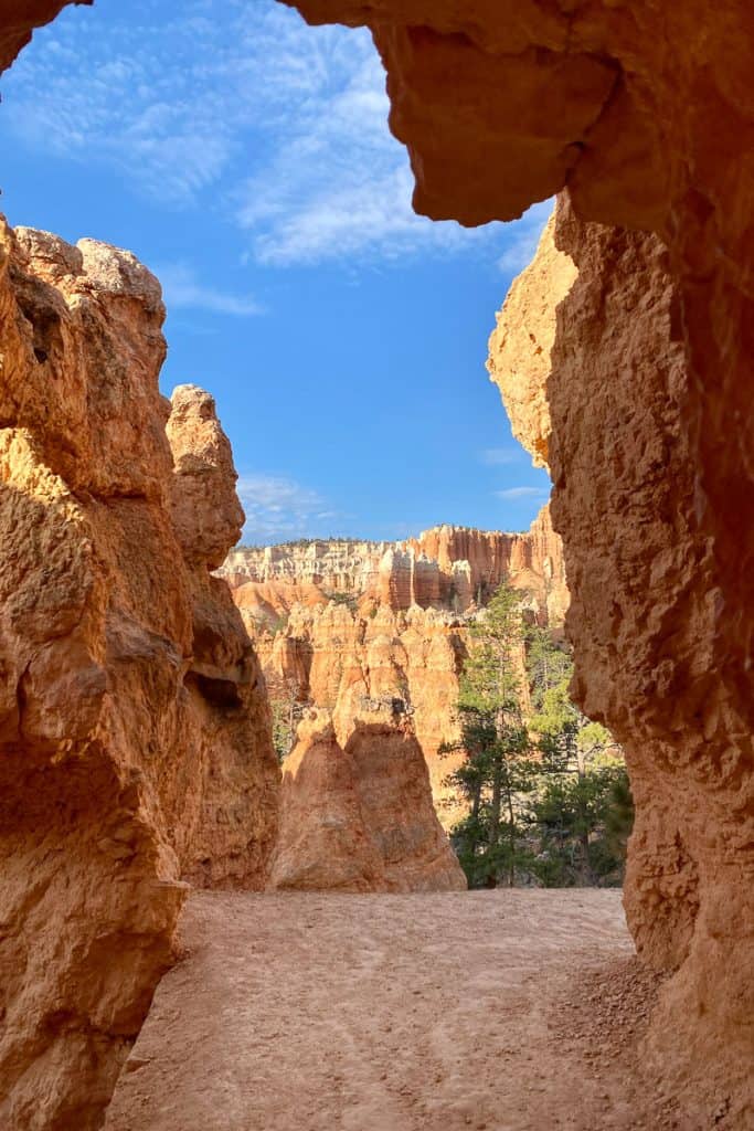 View of Bryce Canyon seen through pillar-like rock formations on Queens Garden Navajo Loop.