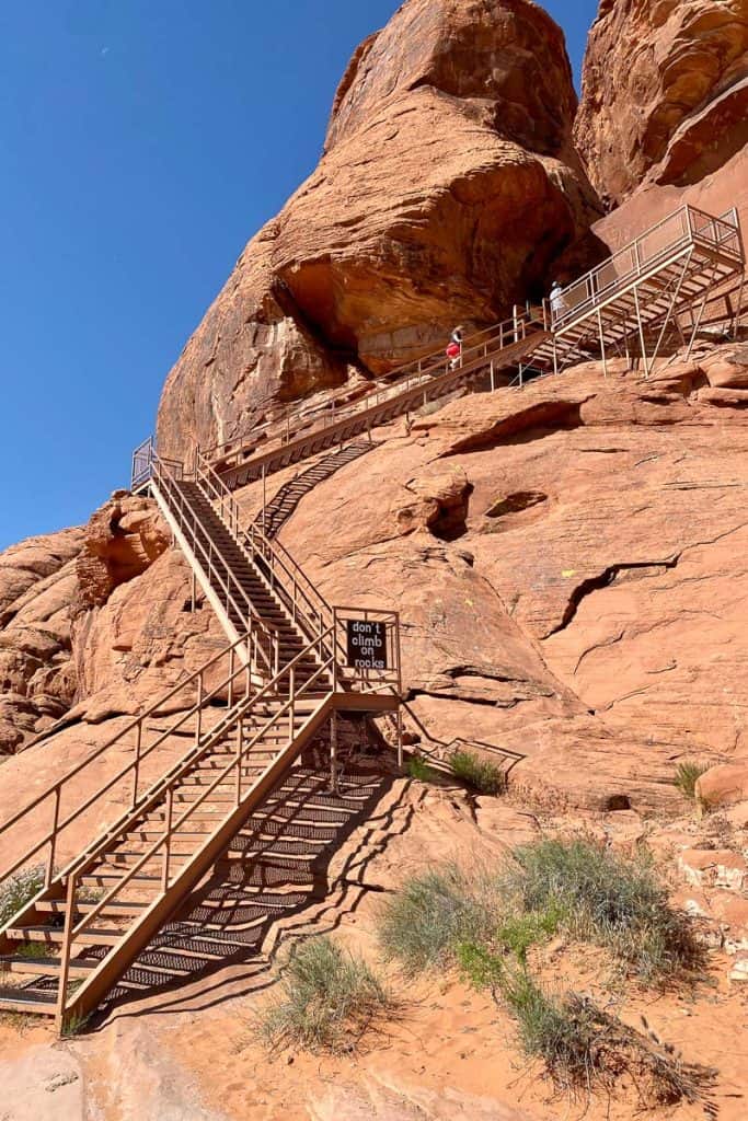 Atlatl Rock, a huge red rock formation with staircase built above it.