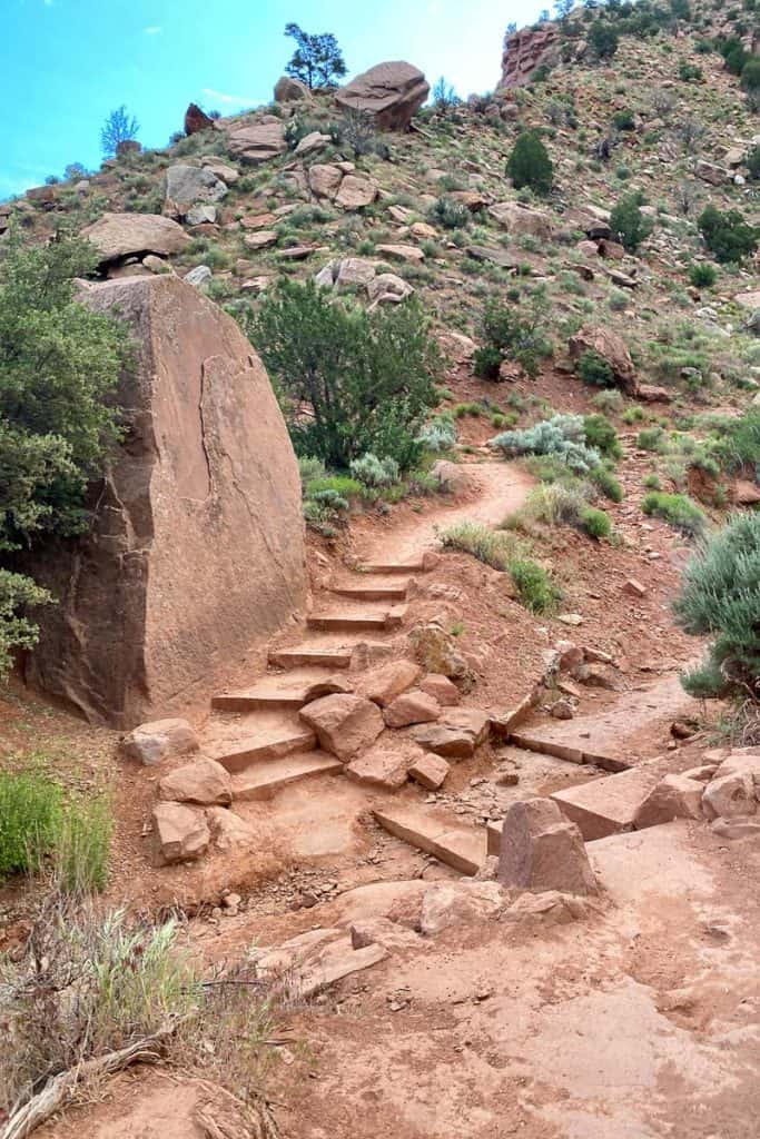 Stone steps next to giant boulder on Watchman Trail.