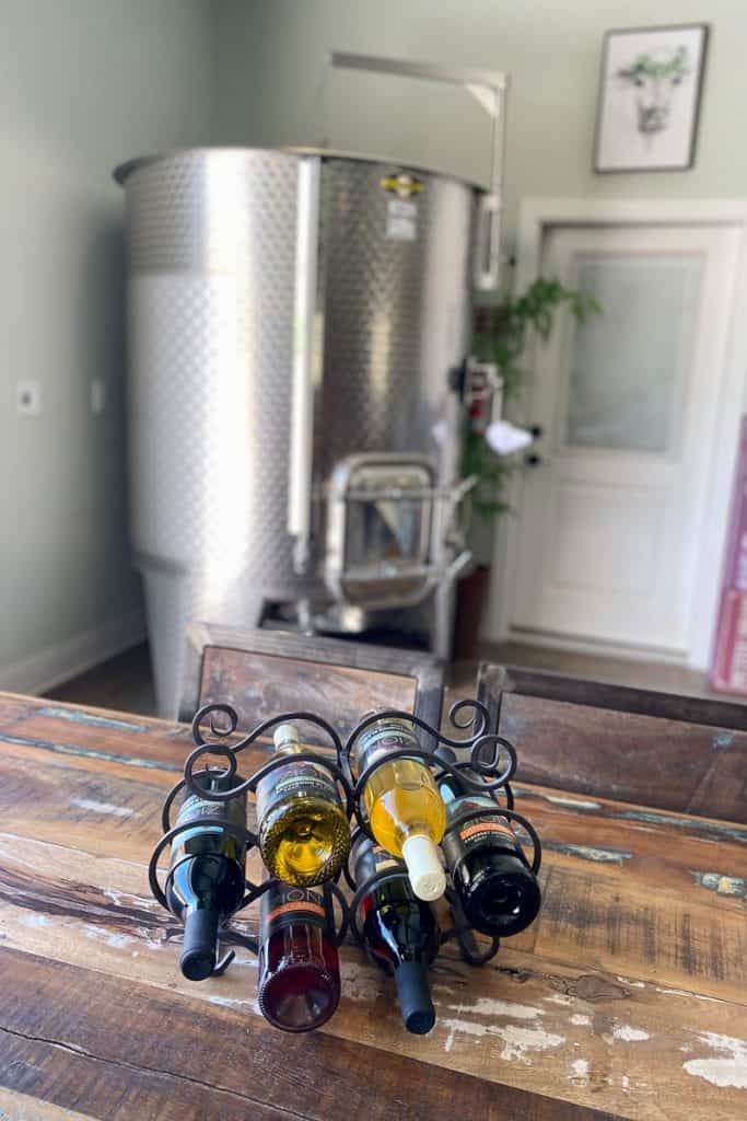 Wine rack storing multiple bottles from Zion Vineyards.