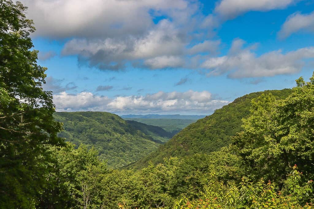 View of distant valleys and wooded hills from Babcock State Park overlook.
