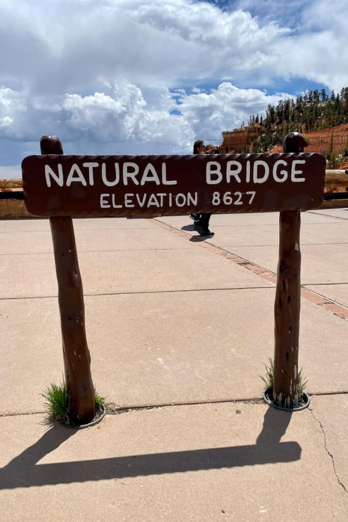 Sign near Bryce Canyon scenic drive that says "Natural Bridge, elevation 8627".