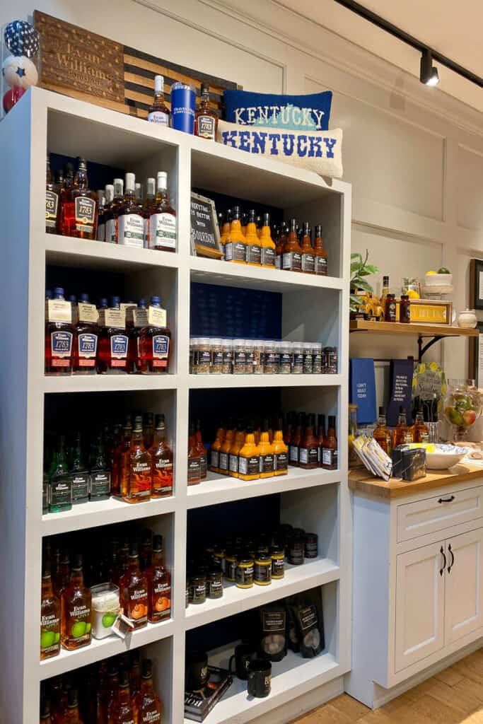Shelves of bourbon-based products for sale.