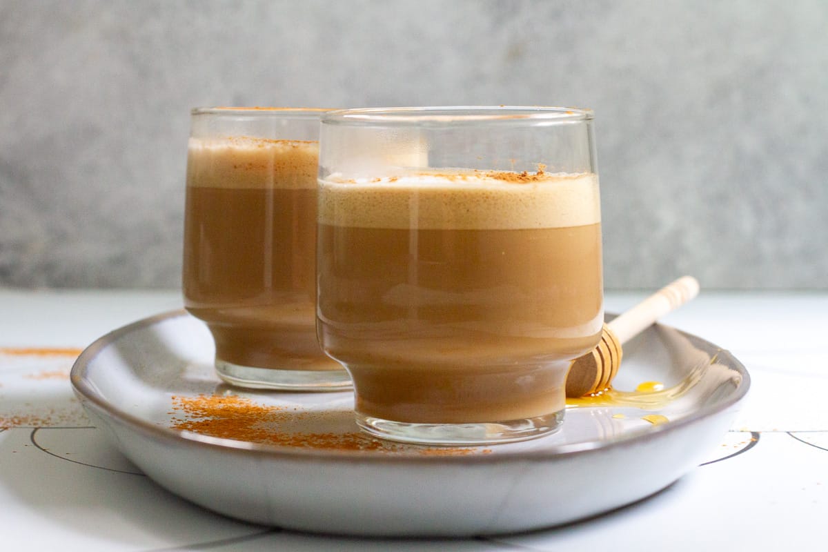 honey cinnamon lattes in clear mugs.