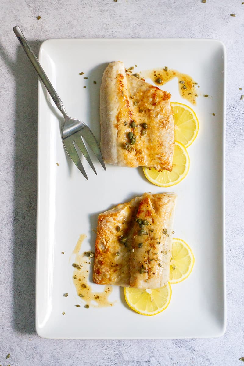 pan-seared walleye on a serving tray.