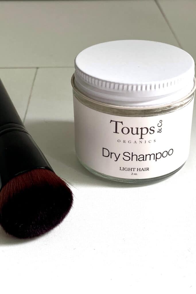 Toups and Co. dry shampoo in jar.
