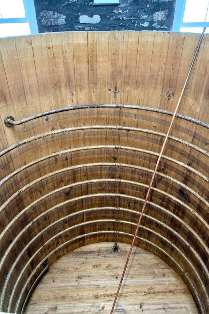 Empty fermenting vat with coils spiraled inside.