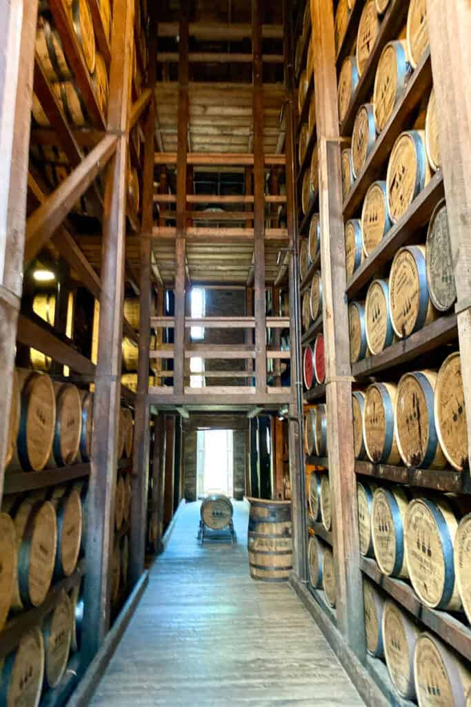 Barrels stacked inside rickhouse.