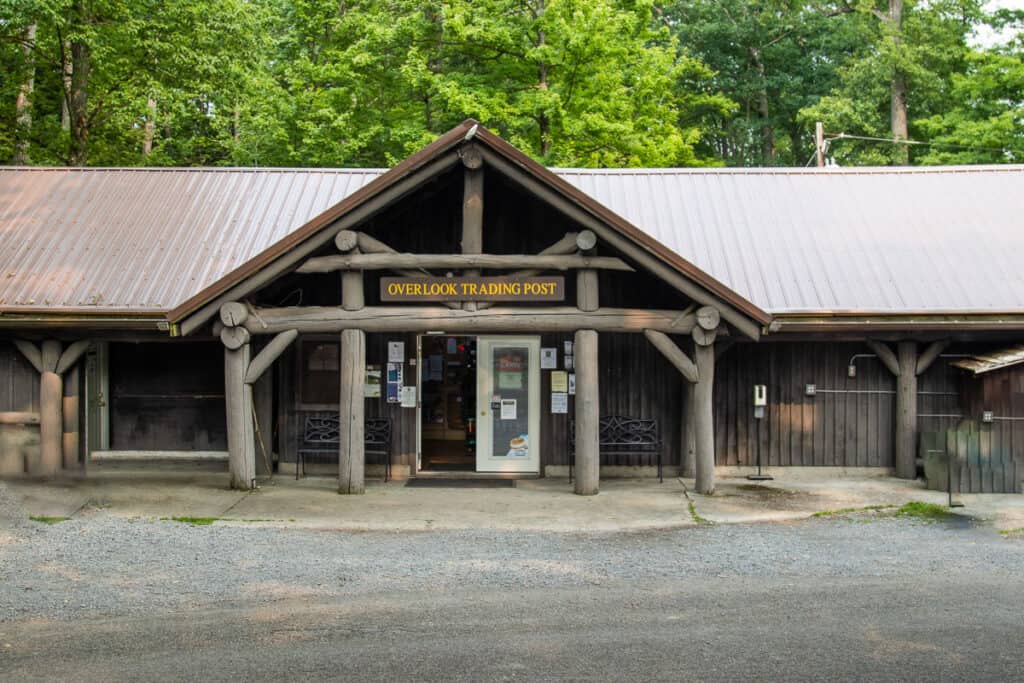 Dark wooden building for Overlook Trading Post.