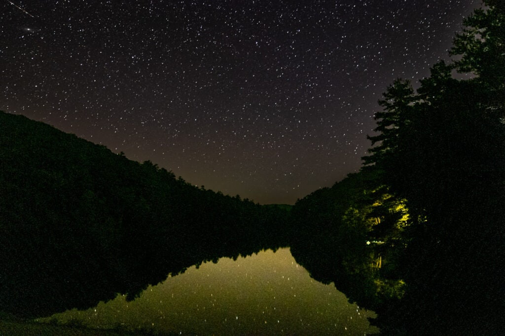 Starry night sky over Watoga Lake.