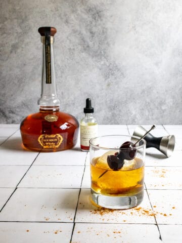 cinnamon old fashioned and bourbon bottle.