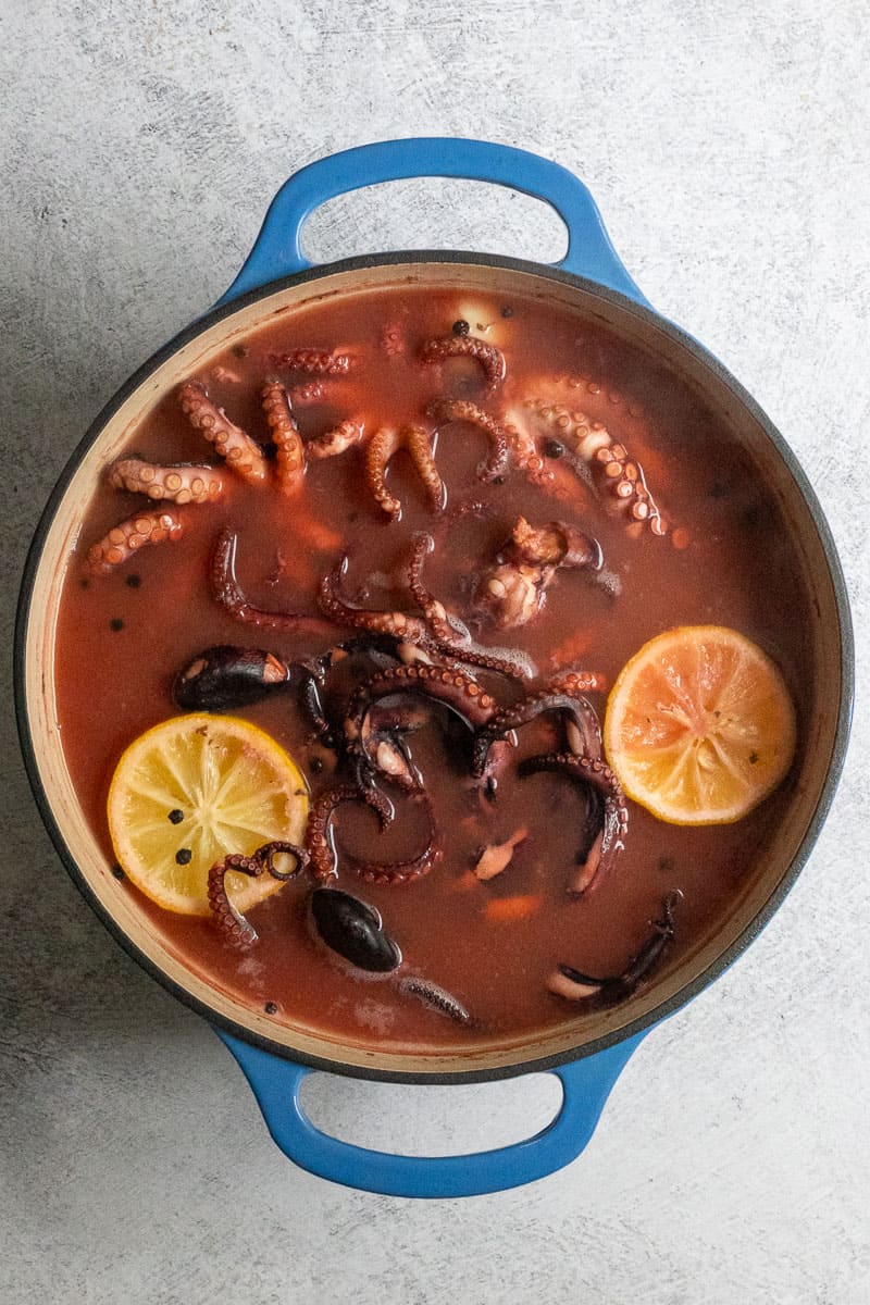 cooked octopus in braising liquid.