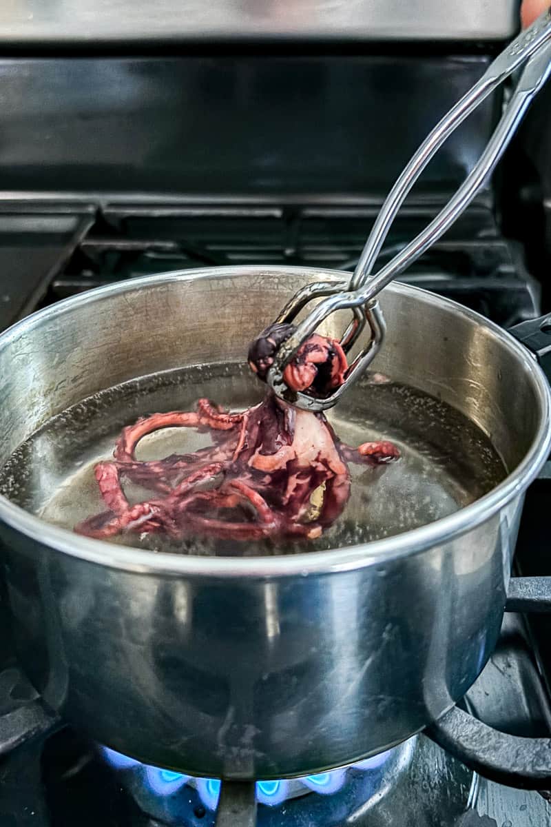 octopus being dipped in hot water.