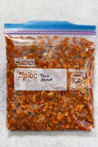 Taco meat stored in plastic freezer-safe bag.