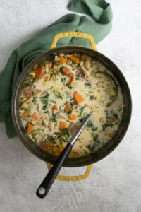 Kale, sweet potatoes, chicken, quinoa, onions and heavy cream in soup pot.