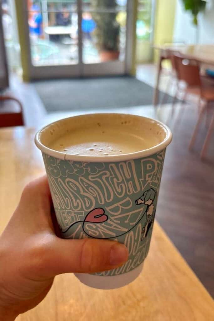 Latte in disposable cup.