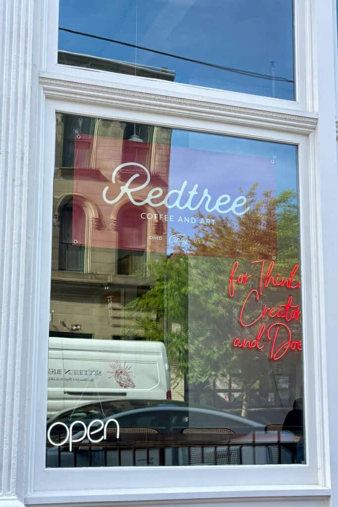 Sign on window for Redtree Coffee and Art.