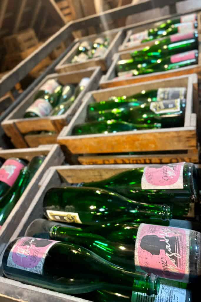 Crates full of green beer bottles.