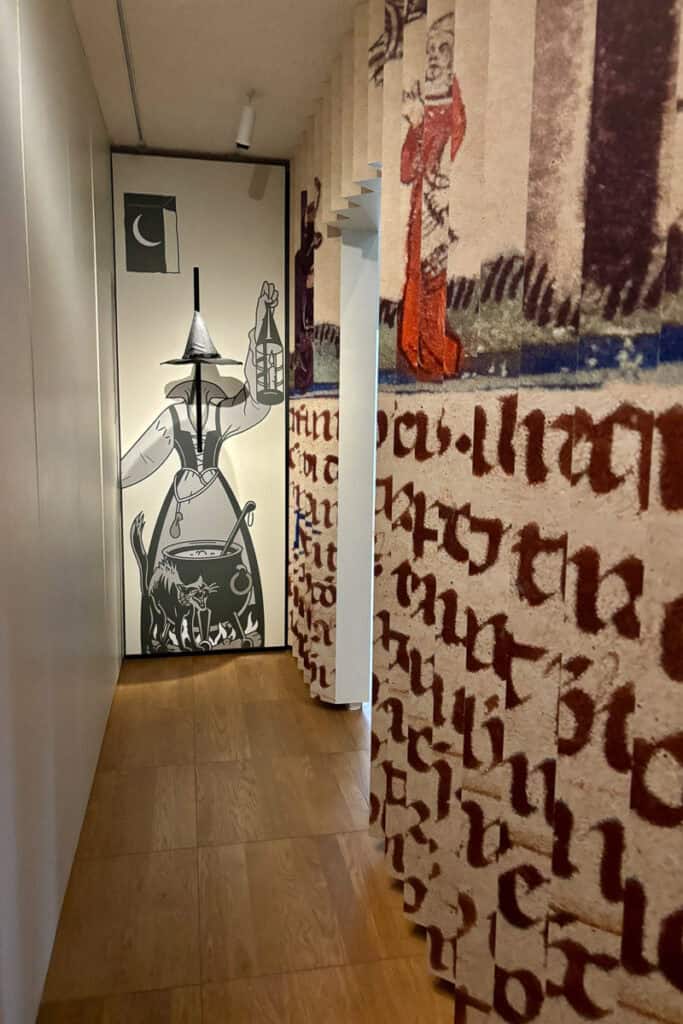 Murals depicting medieval beer brewers in Belgian Beer World Experience.