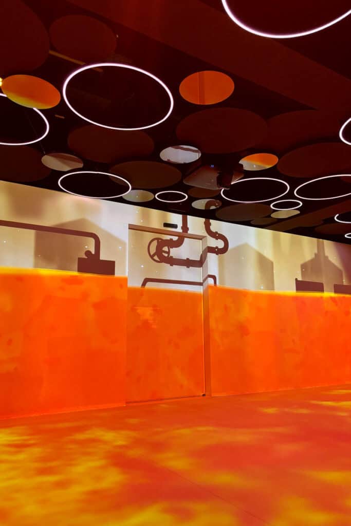 Video room featuring orange and yellow display on walls and floor.