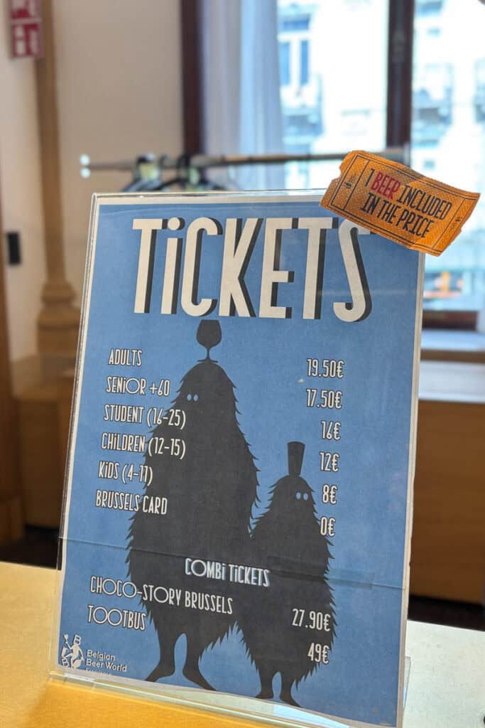 Sign listing ticket prices for Belgian Beer World Experience.