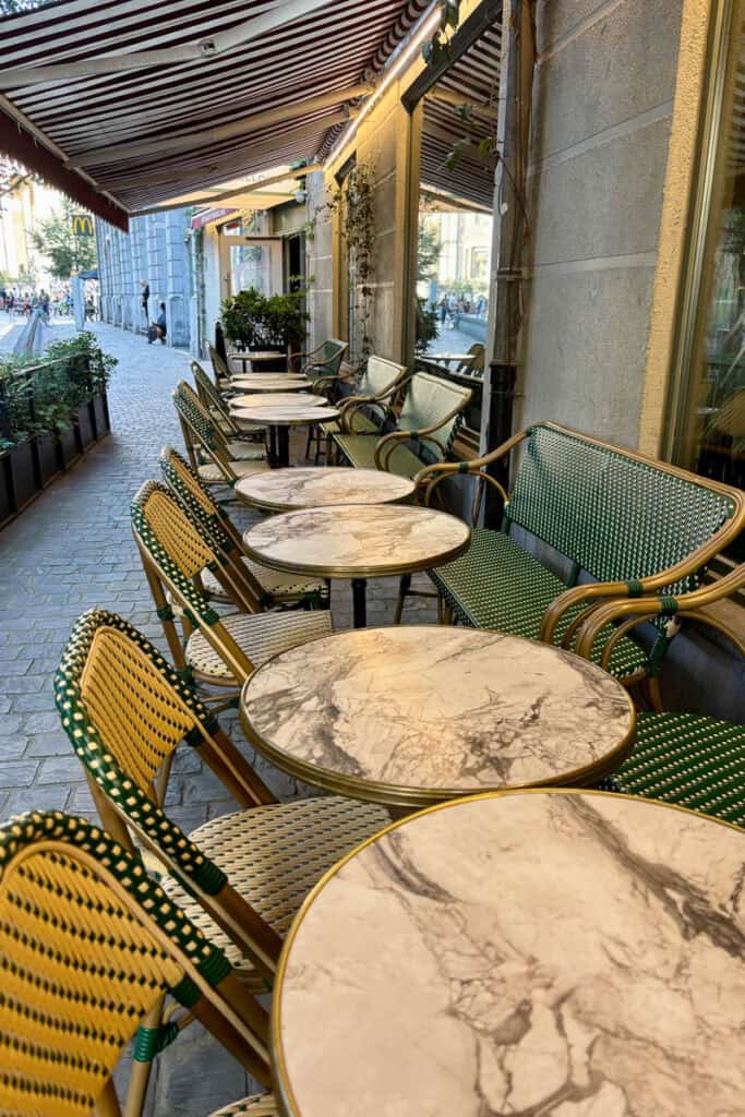 Outdoor dining area under awning.
