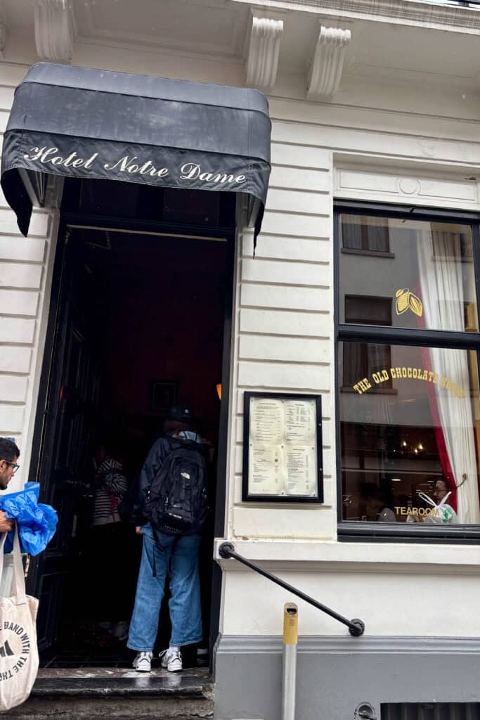 Doorway into The Old Chocolate House under awning that says "Hotel Notre Dame".
