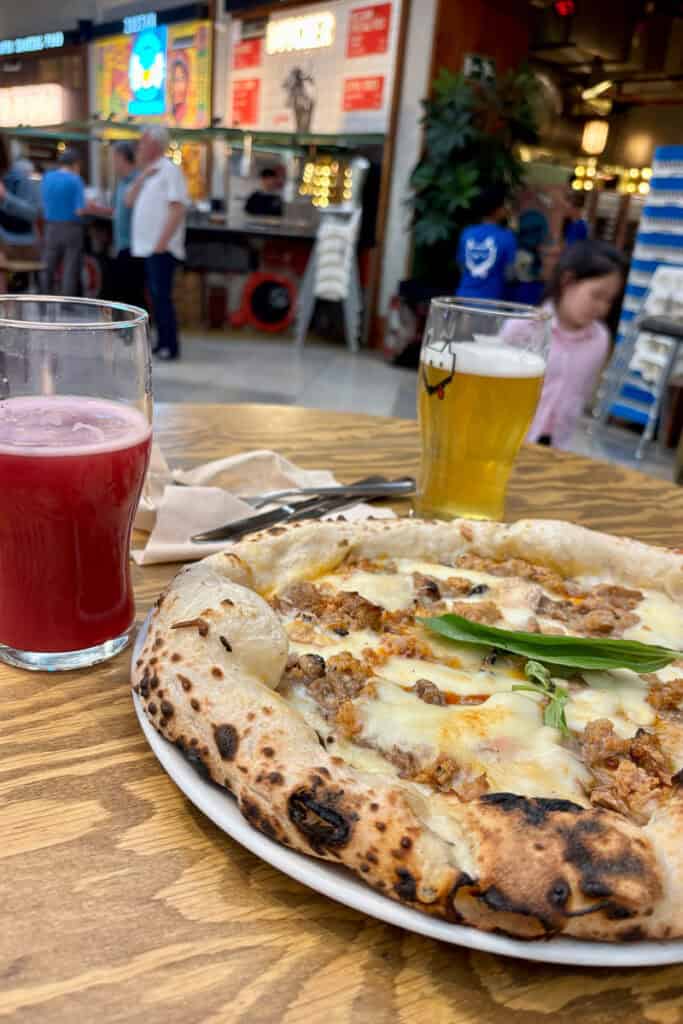 Small pizza and two glasses of beer.