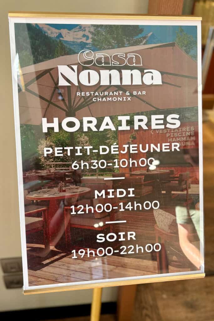 Sign displaying open hours for Casa Nonna.
