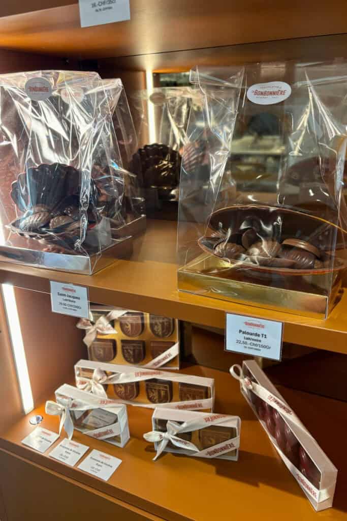 Packages of chocolate molded into different shapes.