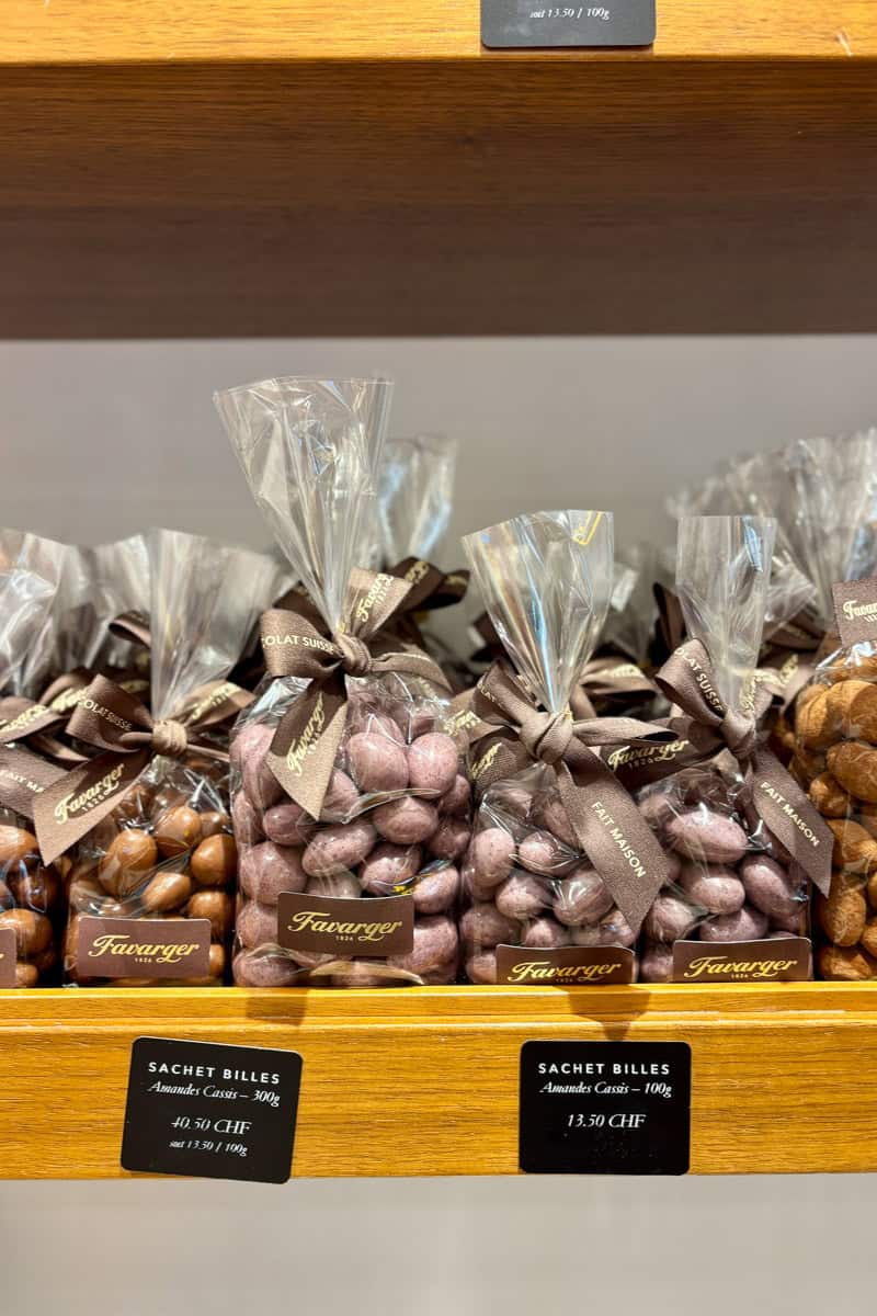 Bags of chocolate almonds for sale.