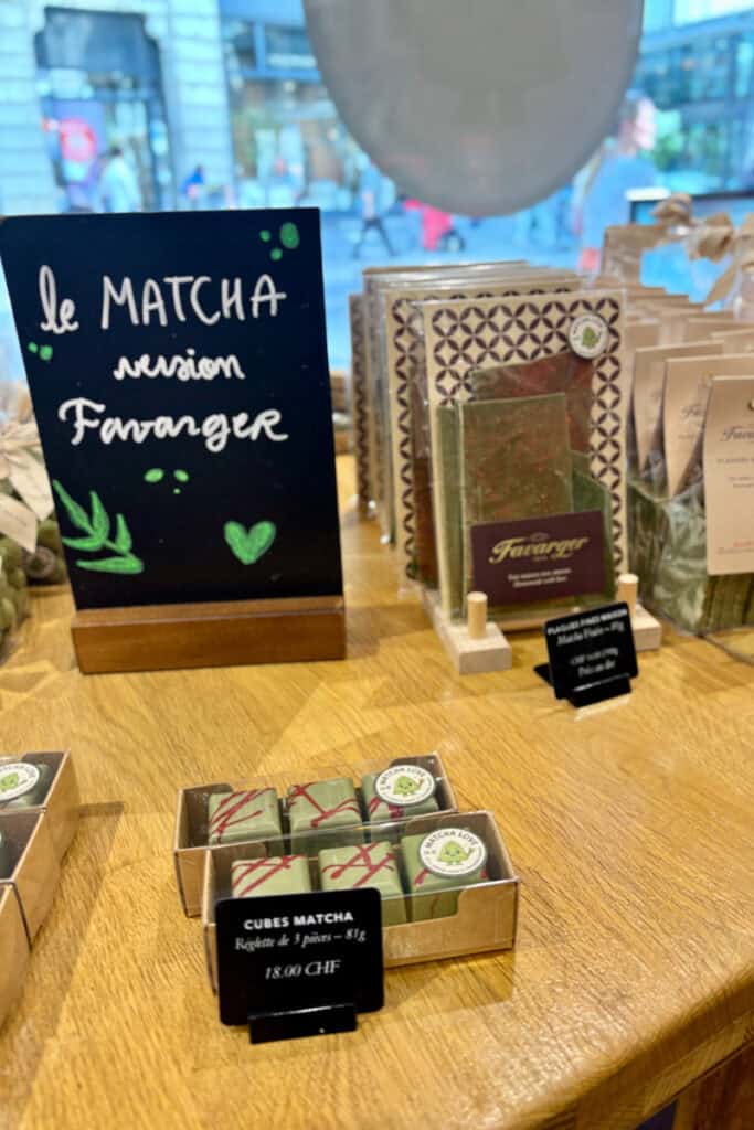 Matcha chocolate cubes in box.