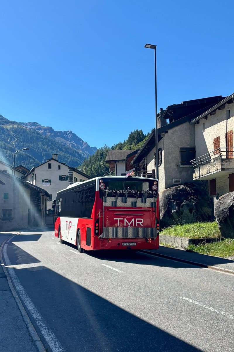 City bus on village street.