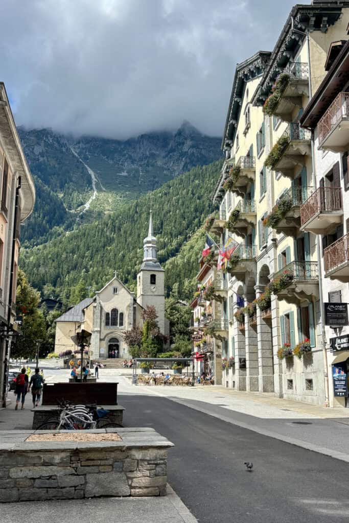 Chamonix street scene with Mont Blanc covered by low clouds.