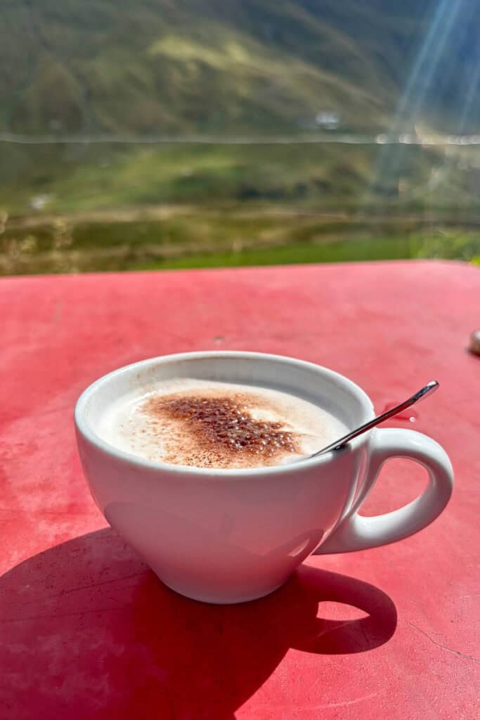 Cappuccino on red tabletop.
