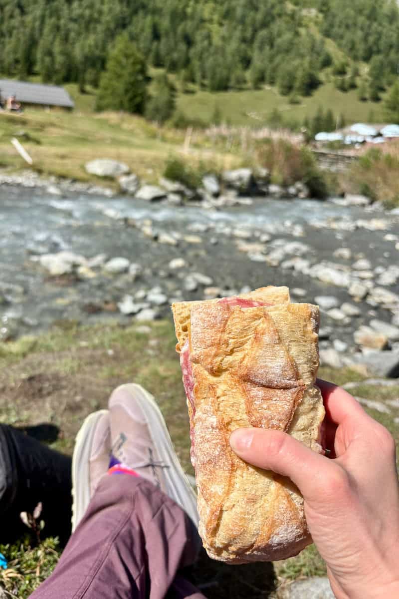Sandwich in hand.