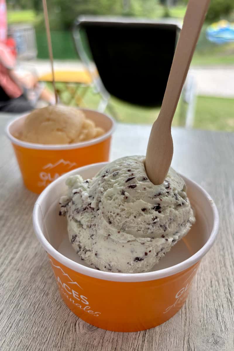 Ice cream scoops in bowls.