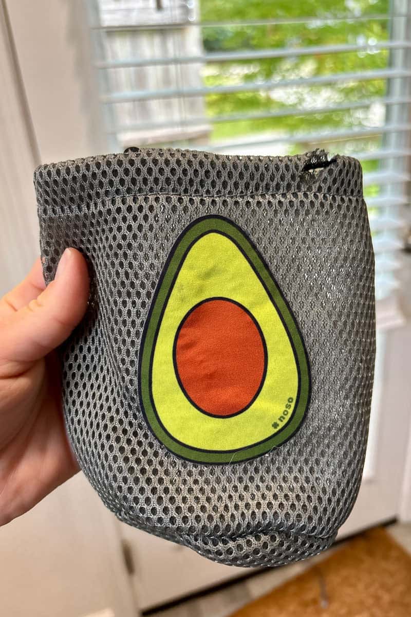 Carry bag with hole covered by avocado-shaped patch.