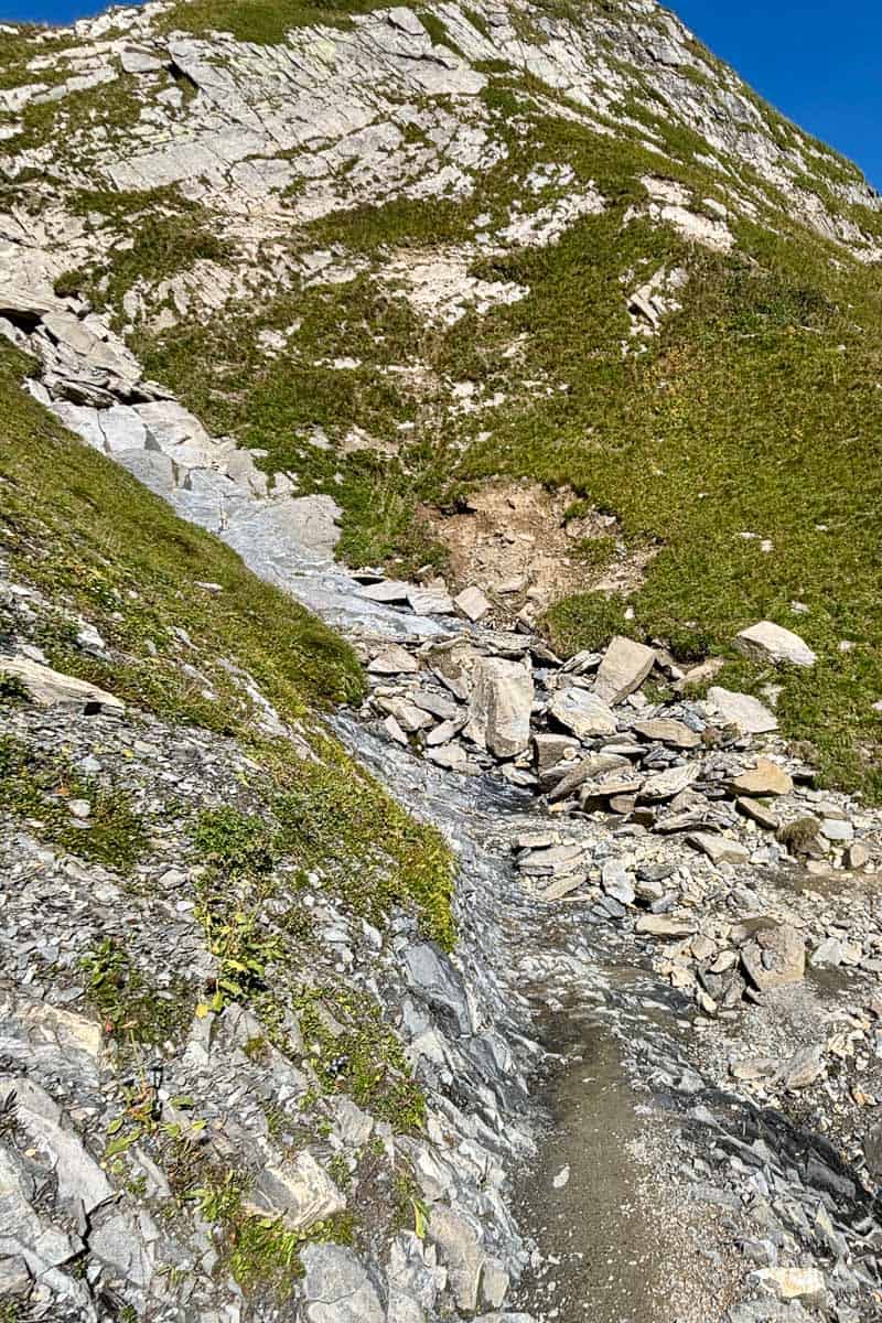 Rocky terrain climbing up to Col du Bonhomme on Stage 2 of the Tour du Mont Blanc.