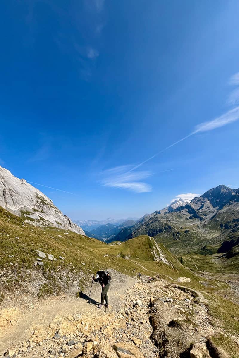 Backpacker on steep uphill trail on Stage 2 of the Tour du Mont Blanc.