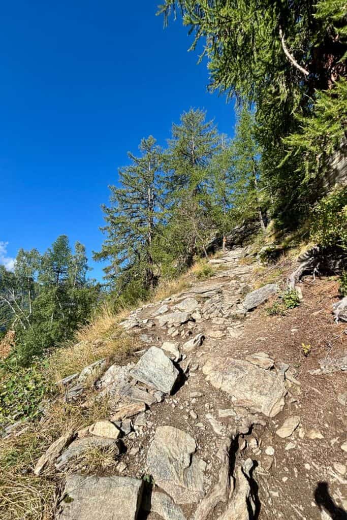 Uphill trail strewn with rocks on Stage 5 of the Tour du Mont Blanc.